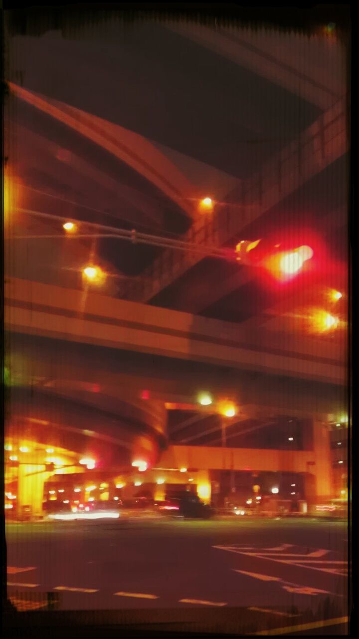 illuminated, transportation, night, transfer print, street, car, land vehicle, architecture, road, mode of transport, building exterior, city, auto post production filter, built structure, light trail, blurred motion, long exposure, street light, motion, traffic