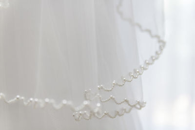 Close-up of white beads on lace