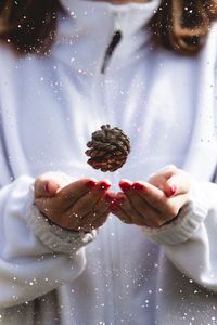 Close-up of hand holding ice cream