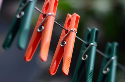 Close-up of clothespins on clothesline