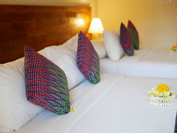 Various flowers on bed at hotel