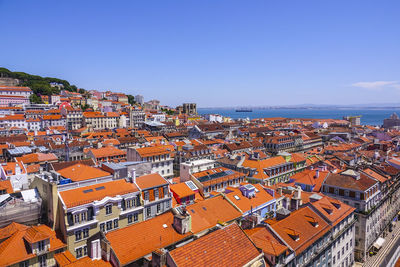 High angle view of townscape against blue sky