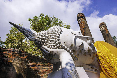 Low angle view of statue against sky