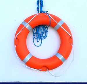 High angle view of red umbrella hanging on rope