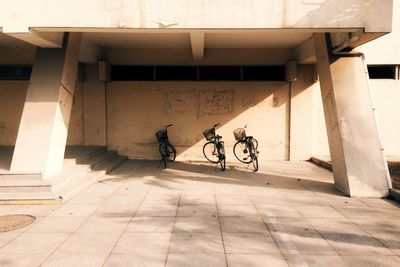 Bicycle parked on floor at building