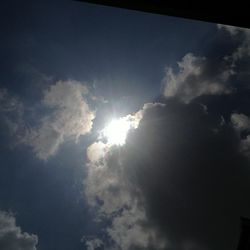 Sun shining through clouds
