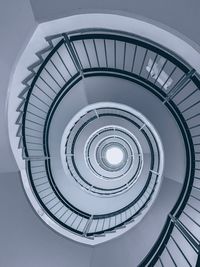 Low angle view of spiral staircase in building