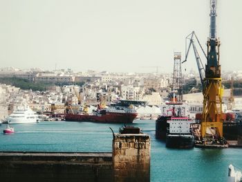 Boats moored at harbor