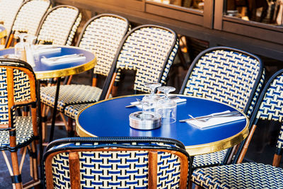 High angle view of empty chairs and table in restaurant