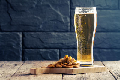 Glass of beer on table