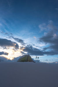 Tent in snow at sunrise, high altitude camping in nepal