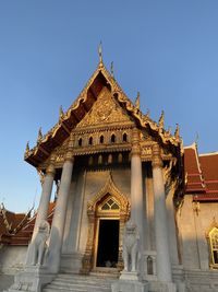 Low angle view of temple building against clear sky