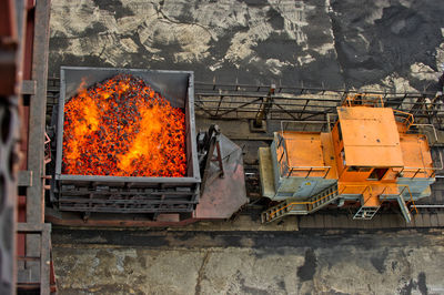 High angle view of burning charcoal in coal mine