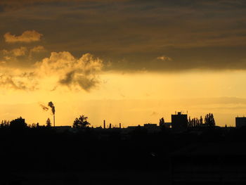 Silhouette of town during sunset