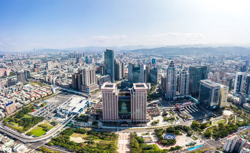 High angle view of modern buildings in city against sky