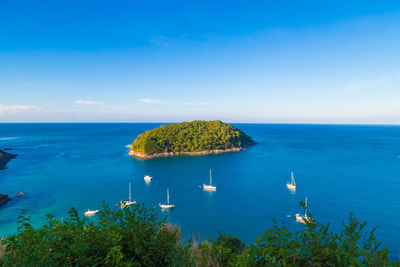 Scenic view of sea against blue sky