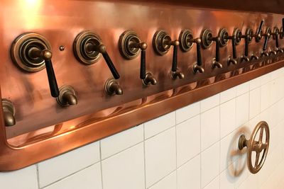 Knobs and faucets on wall