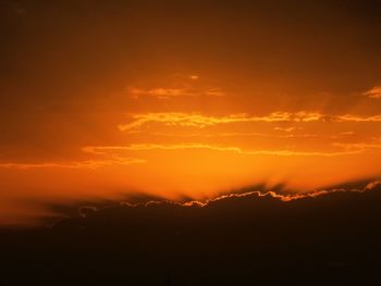 Scenic view of dramatic sky during sunset