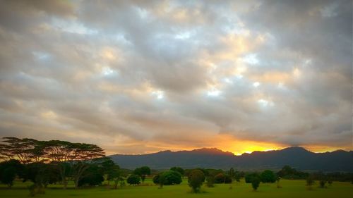 Scenic view of mountains against cloudy sky