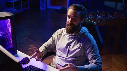 Young man using laptop at home