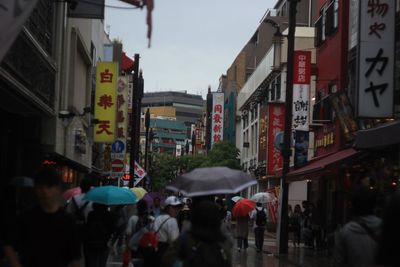 People walking on street in city