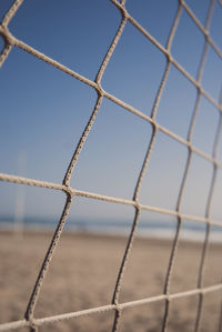 Close-up of sport net against blue sky