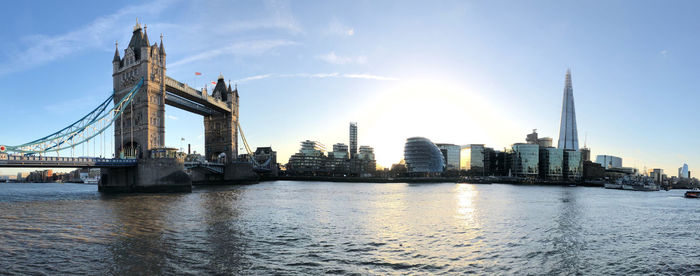 Bridge over river with buildings in background