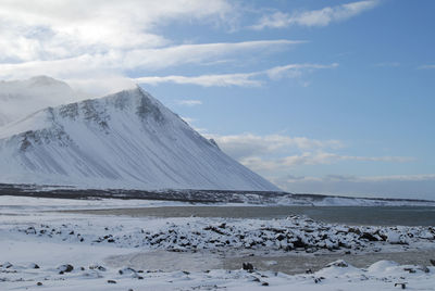 Scenic view of mountains against sky during winter