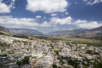 Cityscape with mountain range in background