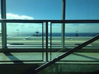 Sea seen through glass window of modern building