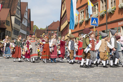 People walking on street in city