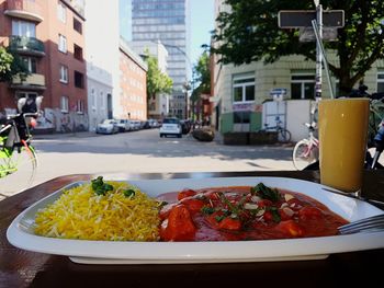 Close-up of food on table in city