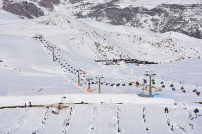 High angle view of people on snowcapped mountain