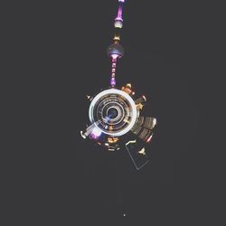 Low angle view of illuminated ferris wheel at night