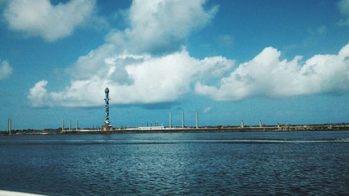 Scenic view of sea against cloudy sky