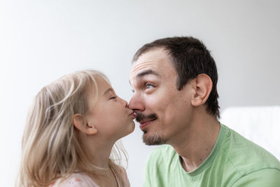 Father and daughter together. daddy at home. young caucasian man with his little girl