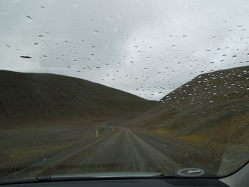 Road seen through car windshield