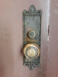 Close-up of door knocker on wall