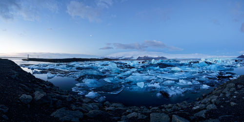 Scenic view of frozen sea against sky