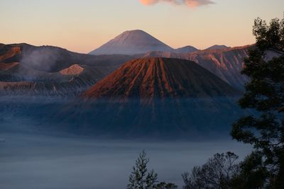 Scenic view of mountains against sky during sunset