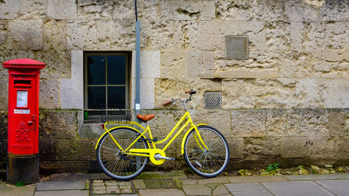 Bicycle parked against wall