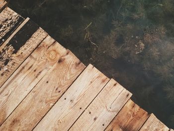 Close-up of wooden pier on boardwalk