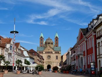 View of city street and buildings against sky