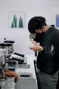 Rear view of man with coffee