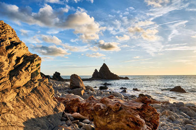 Scenic view of sea against cloudy sky