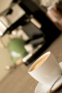 Close-up of coffee cup on table