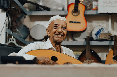 Portrait of happy man working on floor