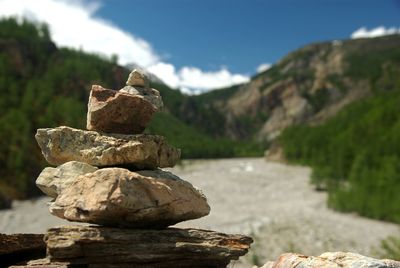 Stack of rocks against mountains