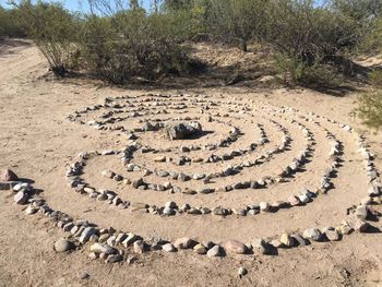 High angle view of pebbles on sand