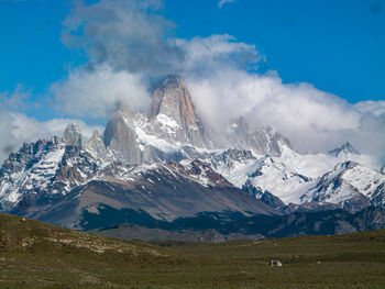 Scenic view of snowcapped mountains against sky